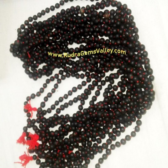 Picture of Black Vaijayanti Wood Beads-Seeds String (mala of 108 vaijayanti 6-7mm beads + 1 rudraksha 16mm beads), pack of 1 string.