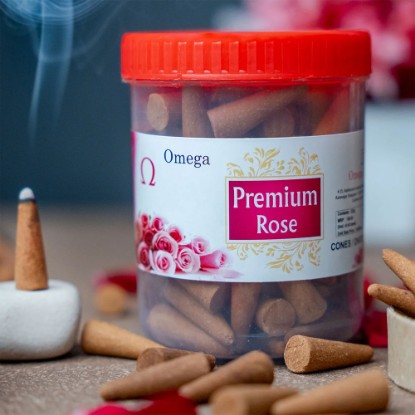 Picture of Omega Premium Rose Incense Cones in Jar, are made with natural rose essential oils, which are known for their sweet and floral aroma that release a pleasant and soothing fragrance, making them perfect for creating a calm and relaxing atmosphere. Cone size 1.5 inches, burning time 20 minutes, weight approx 225 grams.