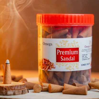 Picture of Omega Premium Sandal Incense Cones in Jar, are made with natural sandalwood essential oils, that release a soothing and refreshing warm and woody aroma, making them perfect for creating a relaxing and peaceful environment. Cone size 1.5 inches, burning time 20 minutes, weight approx 225 grams.